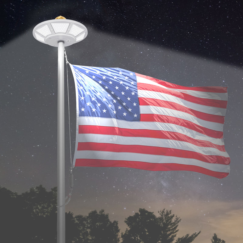 Load image into Gallery viewer, Elite Solar Flagpole Disk Light illuminating an American flag at night, providing bright, even coverage under starry skies.