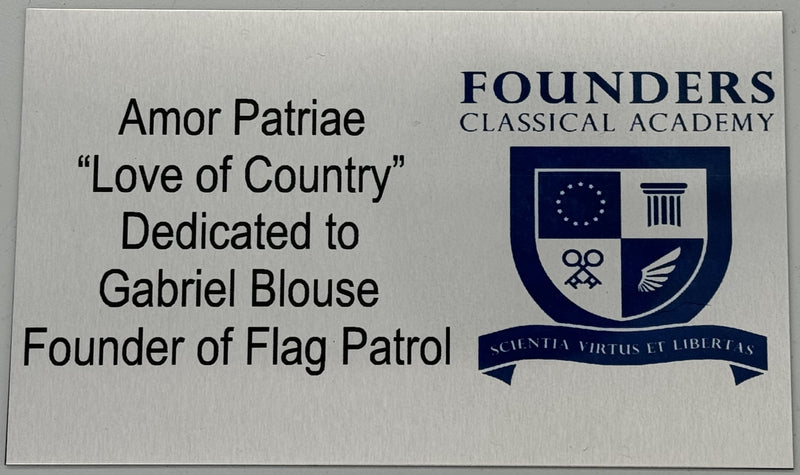 Load image into Gallery viewer, Silver engraved memorial plaque for flagpoles dedicated to Gabriel Blouse, founder of Flag Patrol, reading "Amor Patriae 'Love of Country'" and featuring the blue crest logo and name of Founders Classical Academy.