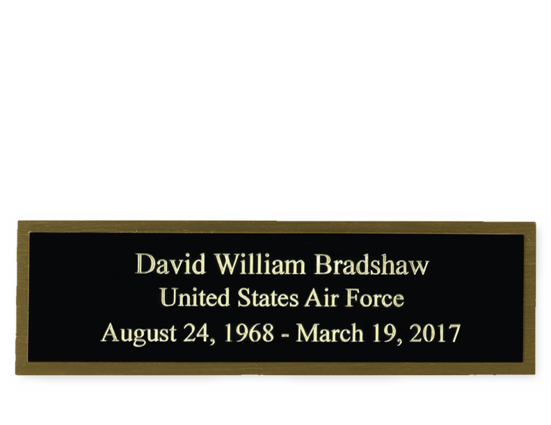 Load image into Gallery viewer, An engraved metal plate with black background and gold border containing white text that honours an individual's service in the United States Air Force.