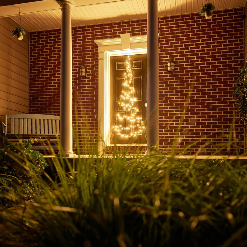 Load image into Gallery viewer, Fairybell warm white door Christmas tree LED display mounted on a front door, illuminating the porch with festive holiday lighting.