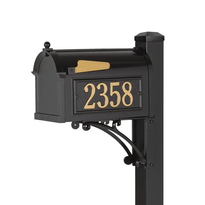 Load image into Gallery viewer, Superior package-sized black mailbox mounted on a matching post. It features gold address numbers (2358) on the front door, a gold-colored flag, and decorative scrolled aluminum support bracket.