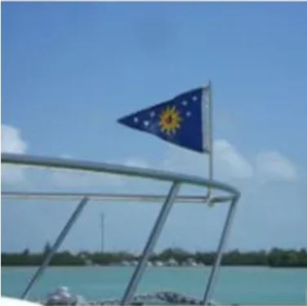 Load image into Gallery viewer, Small blue burgee flag, featuring a yellow sun and white stars, flying from the Original Swiveler Boat Flagpole mounted on a sailboat railing against a bright blue sky.