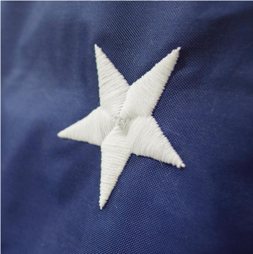 Load image into Gallery viewer, Closeup shot of a star from a US flag, showcasing the detail of the embroidering.