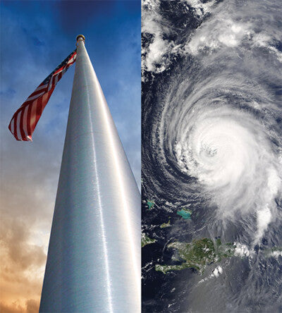 Load image into Gallery viewer, Tall white flagpole with American flag against blue sky, next to satellite image of a hurricane.