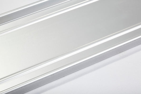 Close-up of smooth aluminum flagpole stand base showing sturdy construction and clean finish.