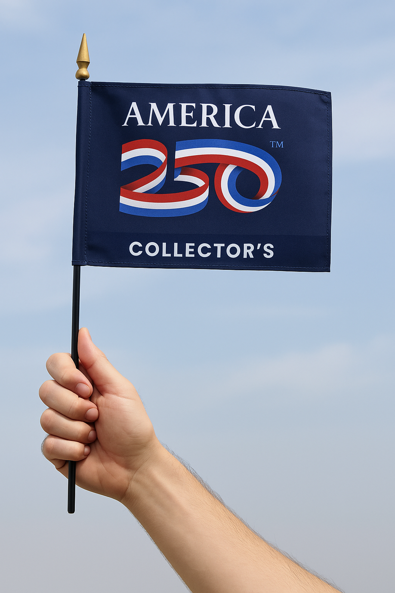 Load image into Gallery viewer, Hand holding America 250™ mounted stick flag with official logo – patriotic handheld flag made in the USA for America’s 250th anniversary celebration
