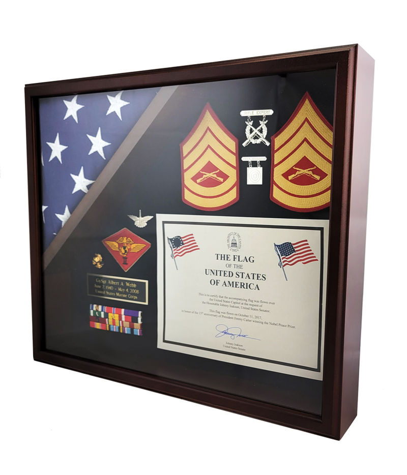 Load image into Gallery viewer, Angled view of a Capitol flag display case with a rich wood finish, organizing a triangular folded flag and various military awards and accouterments.

