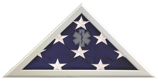 Triangular flag case display showing a folded American flag with a gray Star of Life EMS logo etched onto the protective glass.