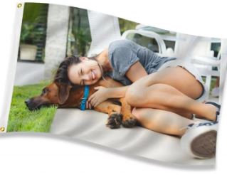 Load image into Gallery viewer, Custom value printed double-sided polyester flag displaying a full-color photo of a smiling woman hugging her dog on the grass.
