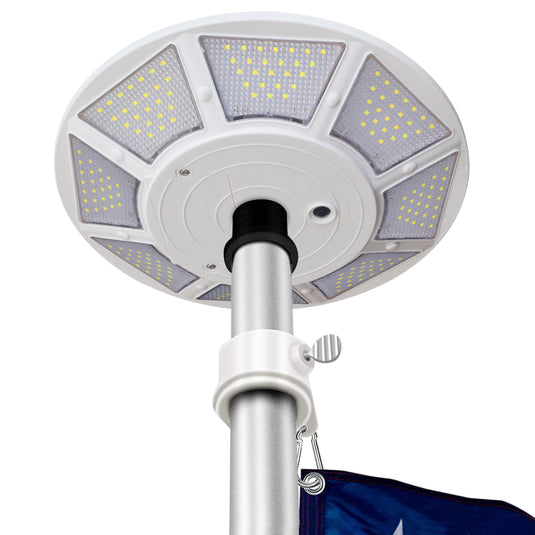 Elite Solar Flagpole Disk Light installed on a flagpole, showing bright LED panels and durable aluminum housing for all-weather use.