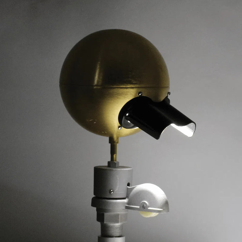 Load image into Gallery viewer, Single External Halyard Beacon Visor installed on a gold beacon light, demonstrating directional beam control for night illumination.
