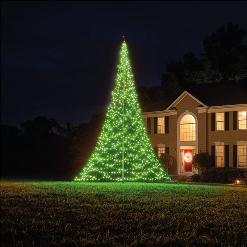 Load image into Gallery viewer, Fairybell Smart Magic Flagpole Christmas Tree Light fully illuminated in bright lime green next to a house at night.
