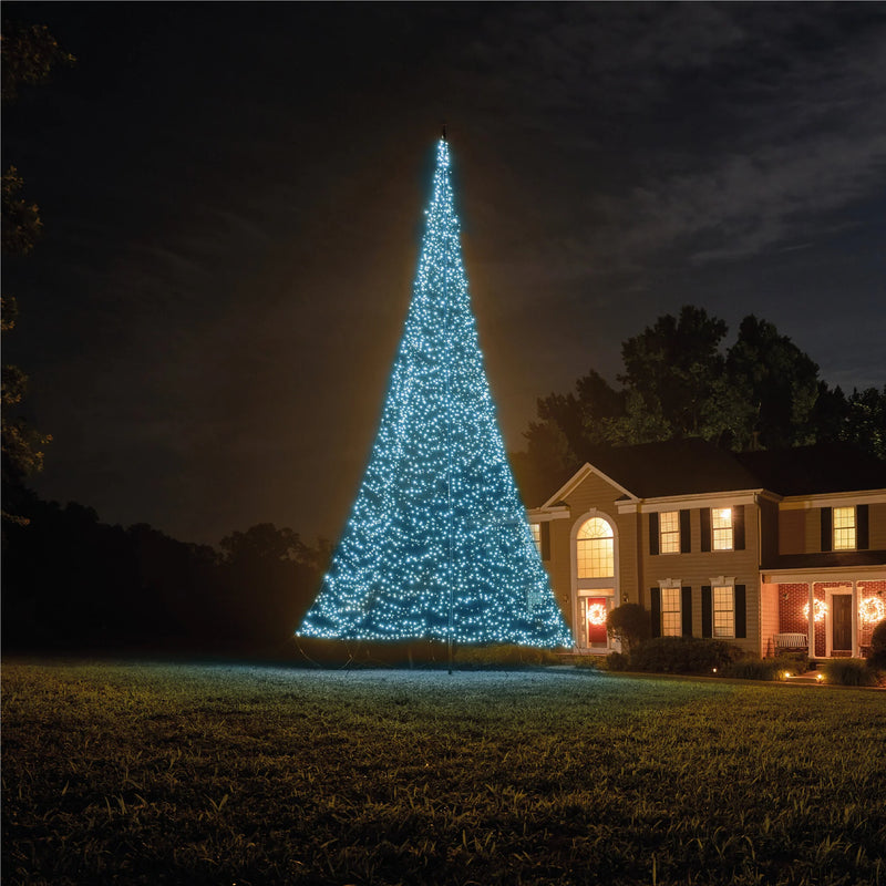 Load image into Gallery viewer, Fairybell Smart Magic Flagpole Christmas Tree Light illuminated in a cool, vibrant light blue color next to a house at night.
