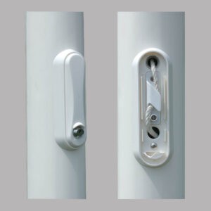 Load image into Gallery viewer, Close-up view of fiberglass flagpole cam cleat and key lock assembly showing the internal halyard mechanism and exterior cover.
