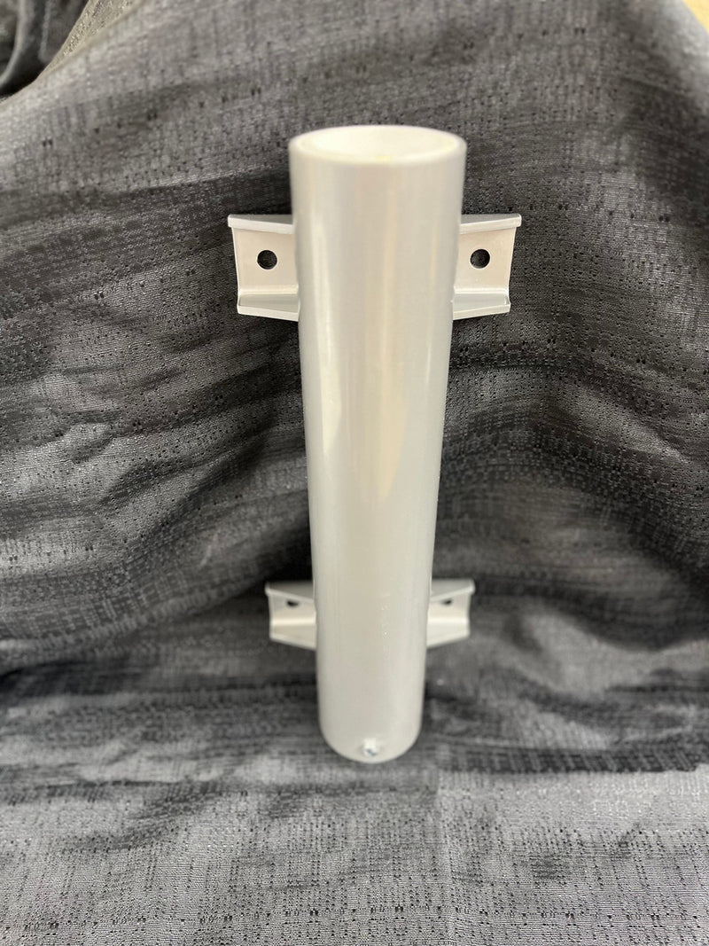 Load image into Gallery viewer, Light grey Flagpole Vertical Wall Mount Bracket (sleeve style) made of smooth, powder-coated metal. The cylindrical tube is secured by two small, rectangular flanges, each with a mounting hole, shown against a dark textured background.
