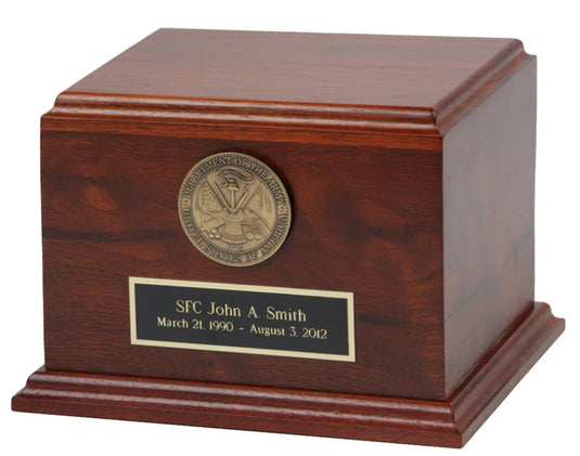 High-quality, USA-made military urn crafted from deep, rich cherry wood with a tiered base and cap. The front is adorned with a brass Department of the Army seal medallion and a personalized black and gold engraved memorial plaque.