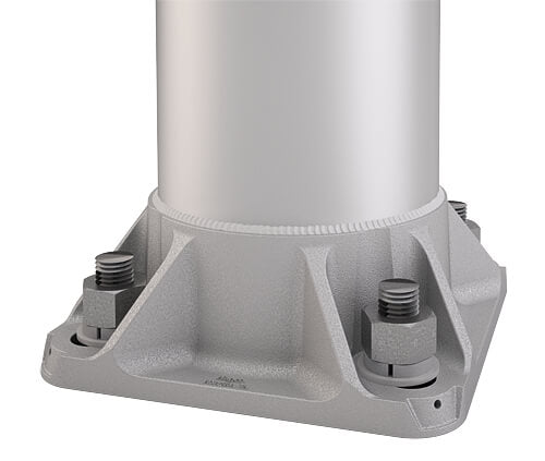 Close-up view of a flagpole base plate assembly (which the flash collar covers), showing the thick, cast aluminum structure bolted to a foundation using four large threaded anchor bolts and nuts. This sturdy base is designed for commercial-grade pole installations.