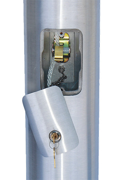 Close-up of the aluminum flagpole shaft showing the reinforced welded door open, revealing the internal halyard cam cleat system and key for security.