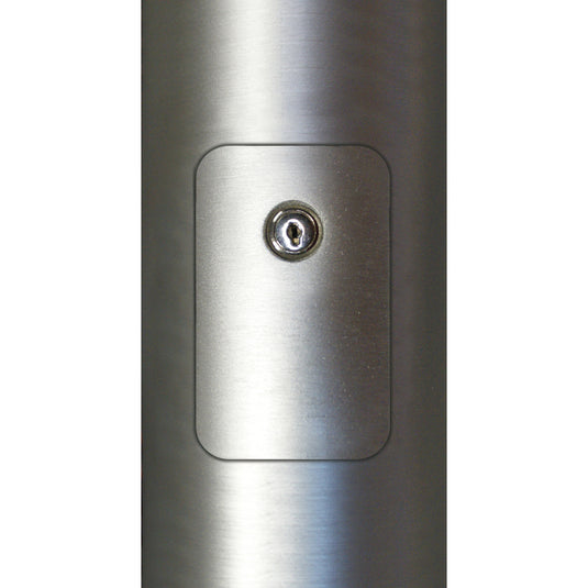 Close-up of the Replacement Cylinder Cam Lock installed within the access door of a brushed metal flagpole.