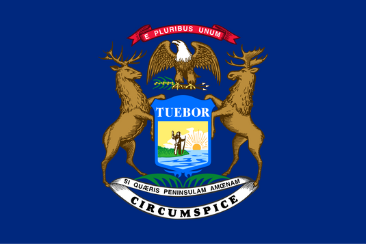 Michigan state flag featuring the state coat of arms with an eagle, elk, and moose surrounding a blue shield showing a man, lake, and rising sun with Latin mottos on a dark blue field.