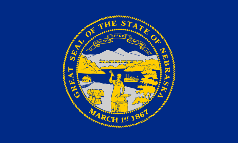 Load image into Gallery viewer, Nebraska state flag featuring the state seal in gold and blue, depicting a blacksmith, train, steamboat, and mountains with the motto “Equality Before the Law.”
