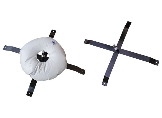 A black metal X-shaped pole base is shown. On the left, it has a circular white sandbag filled with sand, used for stabilizing the pole base.