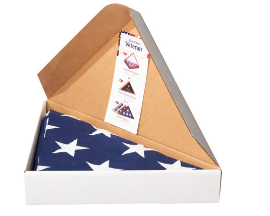 Box with a folded American flag and a Veterans Day card inside