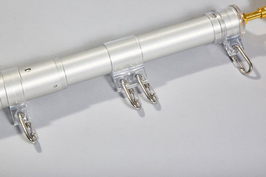 Horizontal view of The Original Telescoping Flagpole Kit pole section detailing the clear polycarbonate swivel rings and heavy-duty snap clips.