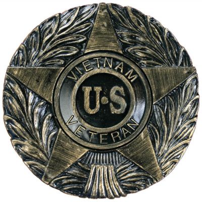 Brass and black thermoplastic memorial marker for a Vietnam U.S. Veteran, featuring a star design surrounded by the war name and laurel leaves.