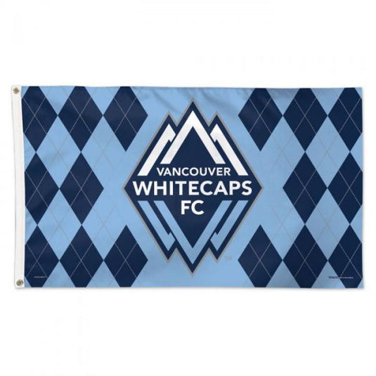 Deluxe Vancouver Whitecaps FC 3x5 MLS flag featuring a blue argyle background pattern of light blue and dark blue diamonds. The center showcases the team's crest: a white mountain peak design surrounding the text 