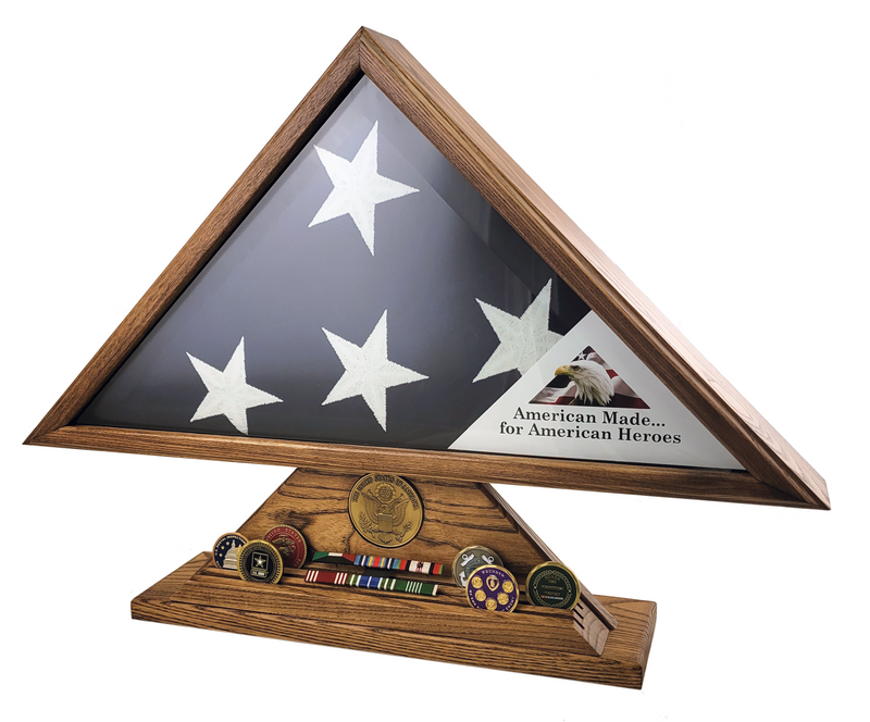 Load image into Gallery viewer, Veteran flag display case made in the USA with an oak wood finish. The triangular case holds a folded American flag and includes a separate base for displaying challenge coins and military ribbons.
