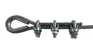 Load image into Gallery viewer, Three wire rope cable clamps securing a loop and thimble onto a piece of galvanized steel cable, demonstrating the proper use for forming a secure rope eye.
