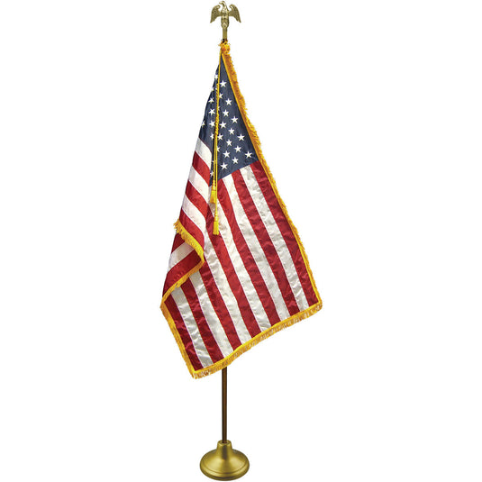 Assembled Deluxe U.S. Indoor Flagpole and Flag Set, featuring an American flag with gold fringe, mounted on a gold pole with a gold eagle finial and a gold floor stand.