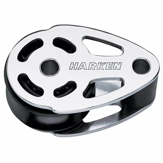 High-strength HARKEN marine-grade pulley block, featuring a shiny stainless steel shell and a black 5 1/2-inch composite sheave (wheel). This hardware is a robust, lightweight sailing accessory designed for heavy load flag halyards.