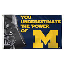 Deluxe Michigan Wolverines Darth Vader 3x5 flag on a navy blue field. The flag features a close-up of Darth Vader's helmet on the hoist side, and gold text that reads: 