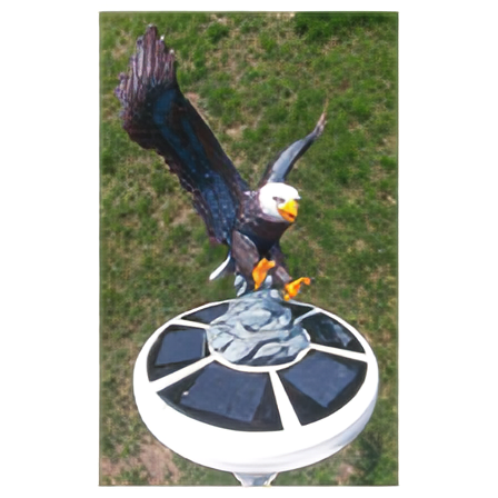 Load image into Gallery viewer, Overhead view of the Resin Landing Eagle Flagpole Ornament perched on a rock base over a black-paneled solar light.
