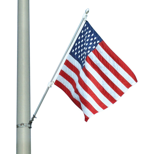 The Streetscape Mounting Kit hardware attached to a thick aluminum pole, displaying an American flag at an angle.